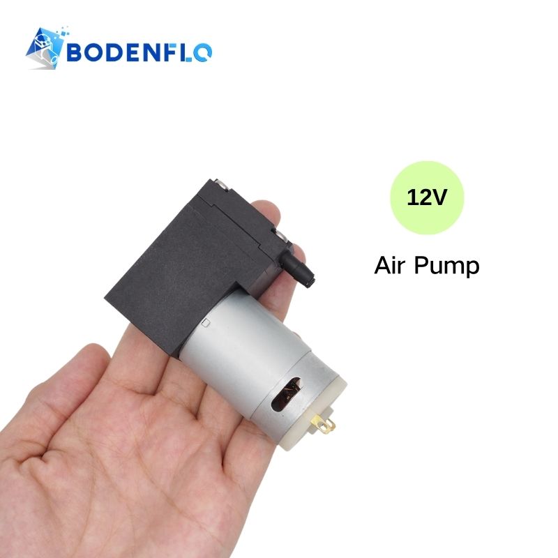 Cover image of the Bodenflo 12V Air Pump showcasing its compact design in a human hand, emphasizing portability and ease of use.