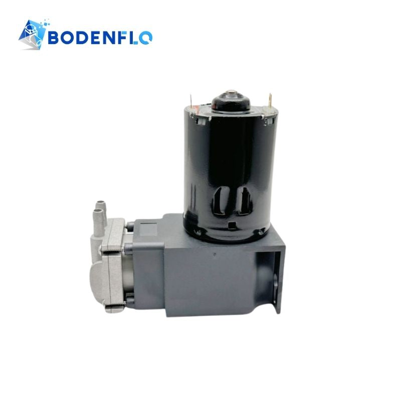 Angled view of the BD-079V-M 12V micro piston pump, showcasing its durable metal head and efficient diaphragm design.