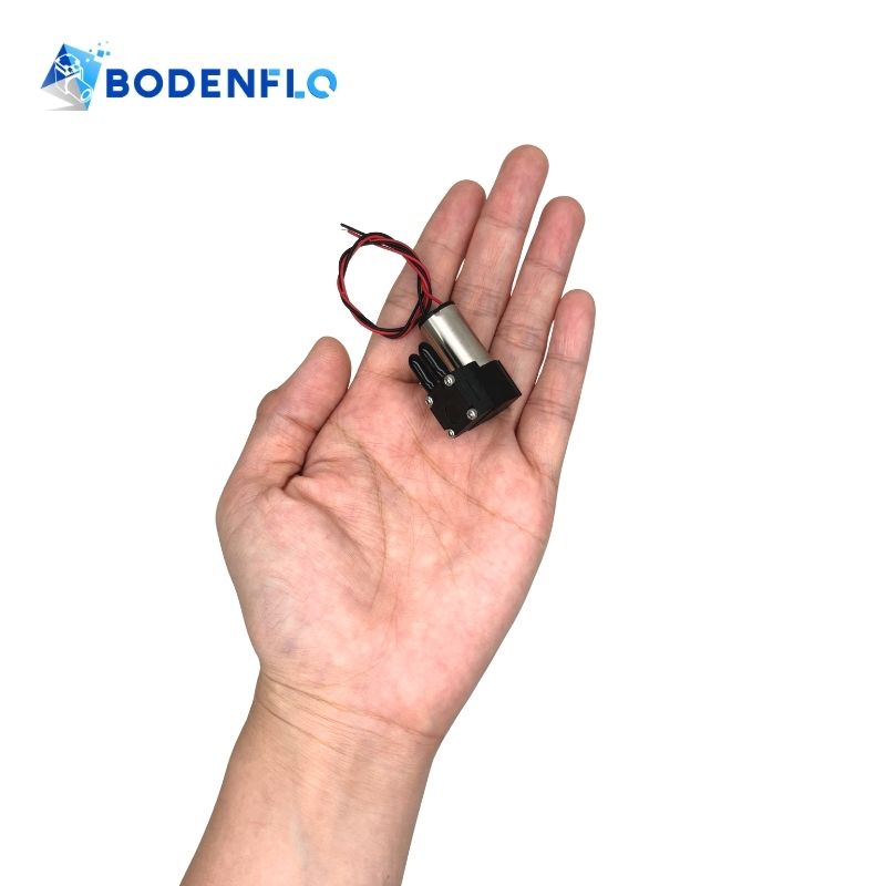 BD-05T01530 mini diaphragm vacuum pump shown handheld for scale – small size and portable