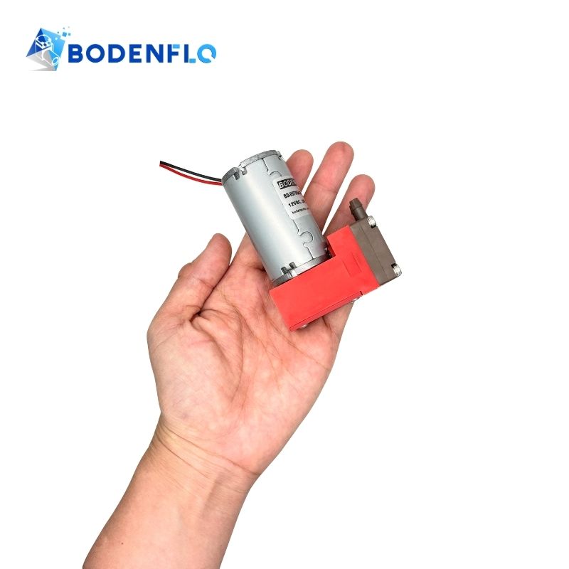 Angled view of 12V miniature diaphragm vacuum pump showing compact design and portability for analytical instruments BD-05T054.6L